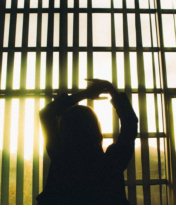 Woman in a calm yoga pose, embodying conscious movement.